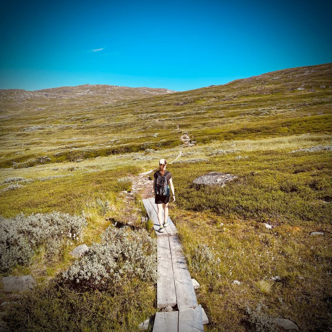 Emma hiking towards some mountains